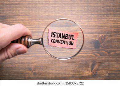 Istanbul Convention. Convention On Preventing And Combating Violence Against Women And Domestic Violence. Man's Hand, Holding Magnifying Glass