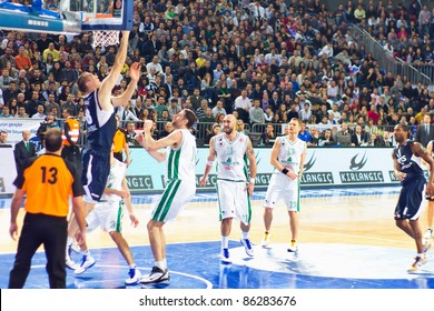 ISTANBUL - JANUARY 20: Igor Rakocevic (18) Releases A Basket At THY Euroleage Top 16 Championship Basketball Game, Efes Pilsen Vs Montepaschi Siena January 20, 2011 In Istanbul, Turkey