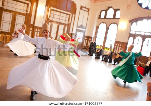 ISTANBUL - JUNE 18: Whirling Dervishes perform a\
sacred mevlana dance at Serkeci Train Station on June 18, 2011 in\
Istanbul, Turkey.