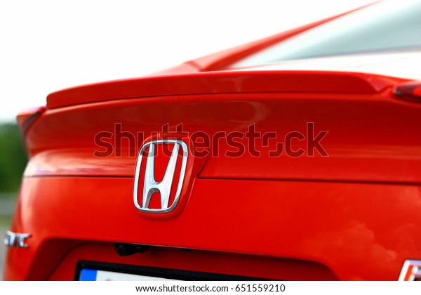 ISTANBUL - JUNE: Close-up of red background\
Honda  logo on June, 2017 in Istanbul, Turkey. The Japanese brand\
that produces land, sea and air\
vehicles.