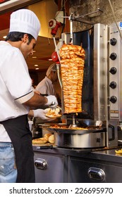 ISTANBUL - MAY 17, 2014 - Cook Slices Meat From The Turning Spit For Shawarma Doner Kababs  In Istanbul, Turkey