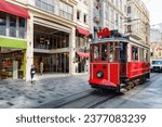 The Istanbul nostalgic tram on Istiklal Avenue. The historic tram is a popular tourist attraction. Awesome view of the street on sunny day.