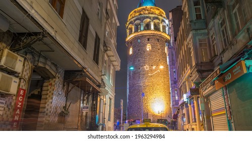 ISTANBUL - OCTOBER 2014: Galata Tower At Dusk. Istanbul Hosts More Than 10 Million People Annually.