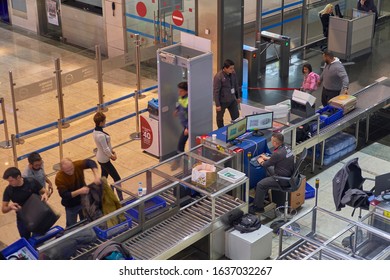 Istanbul Sabiha Gokcen Airport - January 2020. Queue Of People Walking Through Metal Detector Frame.