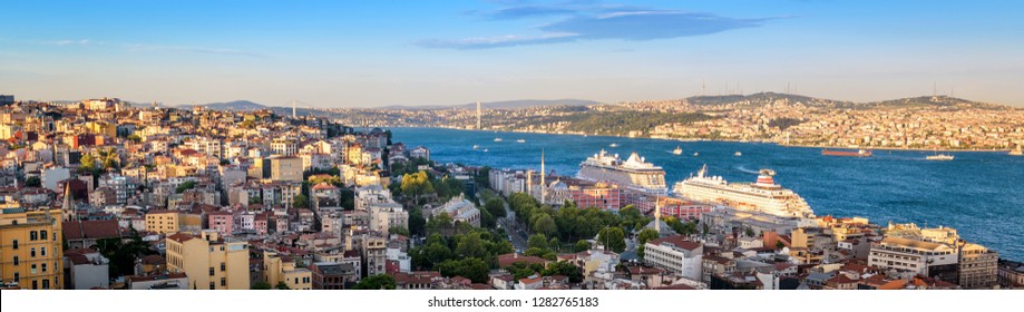 Istanbul skyline at sunset, Turkey. Aerial panoramic view of Istanbul city divided by the Bosphorus. Beautiful cityscape of Istanbul with cruise ships. Traveling and vacation in Istanbul in summer.