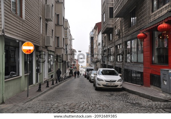 Istanbul street. Cobblestone\
street and residential buildings. 05 January 2014 Istanbul,\
Turkey.