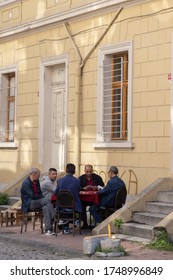 Istanbul Turkey 12/10/2019 Men Sitting In The Street Playing Games, Backgammon And Cards