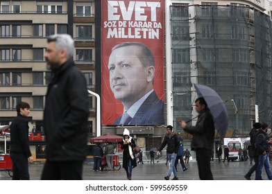 ISTANBUL, TURKEY, 13 MARCH 2017 People Walk In Front Of A Picture Of Turkish President Recep Tayyip Erdogan. Turkey Will Hold A Referendum On April 16 To Move To The Presidential System.