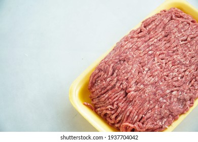 Istanbul, Turkey, 16.03.2021, Raw Ground Beef In A Yellow Polystyrene Tray Isolated On A White Background.