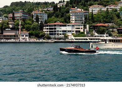 Istanbul , Turkey 4 June 2022 Power Boat Speed Boat Passing Across Bosphorus Sea, People Enjoying Sunny Day In A , Motor Boat, Luxury Lifestyle, City Urban View At Background, 