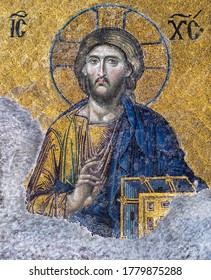 ISTANBUL, TURKEY - APRIL 17, 2015: Jesus Christ at golden backdrop in the Hagia Sophia temple in Istanbul. Ancient byzantine mosaic of the image of Jesus Pantocrator with a blessing hand and Gospel.