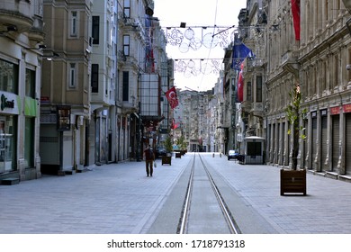 Istanbul, Turkey - April 2020: Shows the deserted Istiklal street at Taksim district in Istanbul, during a two-day curfew to prevent the spread of the epidemic COVID-19 caused by the novel coron