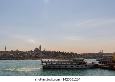 Karaköy Istanbul / Turkey - April 22 2019: View Of Golden Horn Haliç With Sea Boat And Yavuz Selim Mosque, Süleymaniye Mosque And Rüstem Pasha Mosque