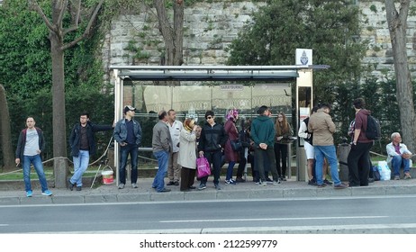 Istanbul, Turkey - April 23, 2018: People Wait At A Busstop On A Street In The City Centre.