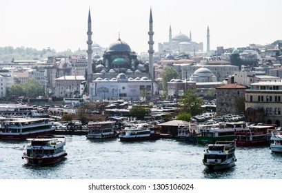 Istanbul, Turkey – April 30, 2018: Moning View Of The Golden Horn Bay With The Eminonu Pier On The Background Of The The Rüstem Pasha Mosque And The Suleymaniye Mosque.