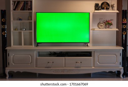 Istanbul, Turkey - April 4 2020: Big Green Screen Led TV In A Cozy Living Room. Modern 55 Inch Sized Television With Chroma Key Green Screen Over A TV Unit.