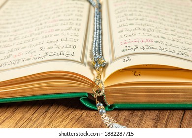 Istanbul, Turkey - April 5, 2015; A Quran book opened with a rosary. Quran - holy book of innocent Muslims (breadth of all Muslims).