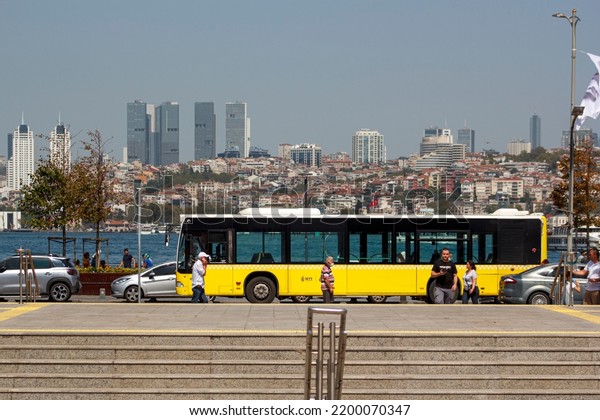 istanbul Turkey August 28, 2022: seashore road\
in Uskudar district, one of the attraction center of Asia side,\
Bosphorus, Europe urban landscape on background, daily life (\
Üsküdar, iett otobüsü)