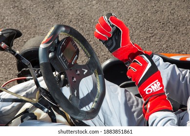 Istanbul, Turkey -August 5 2019 : Driver In Gear, Gloves And Helmet Drives A Racing Car. Go Kart In Action.