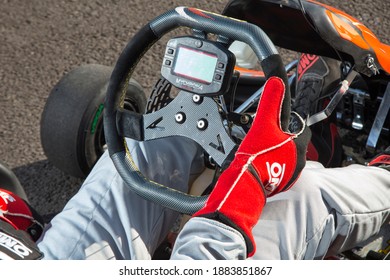 Istanbul, Turkey -August 5 2019 : Driver In Gear, Gloves And Helmet Drives A Racing Car. Go Kart In Action.