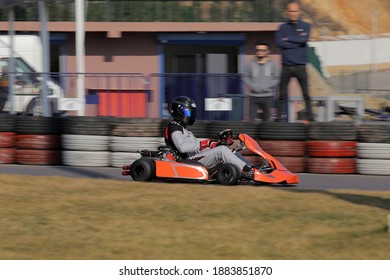 Istanbul, Turkey -August 5 2019 : Driver In Gear, Gloves And Helmet Drives A Racing Car. Go Kart In Action.