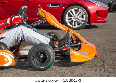 Istanbul, Turkey -August 5 2019 : Driver In Gear, Gloves And Helmet Drives A Racing Car. Go Kart In Action.