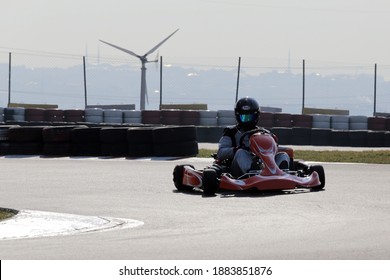 Istanbul, Turkey -August 5 2019 : Driver In Gear, Gloves And Helmet Drives A Racing Car. Go Kart In Action.