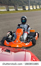 Istanbul, Turkey -August 5 2019 : Driver In Gear, Gloves And Helmet Drives A Racing Car. Go Kart In Action.