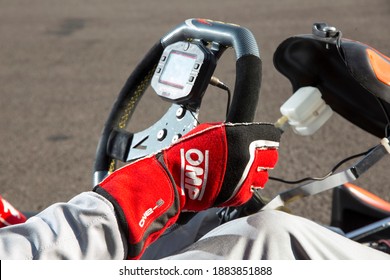 Istanbul, Turkey -August 5 2019 : Driver In Gear, Gloves And Helmet Drives A Racing Car. Go Kart In Action.