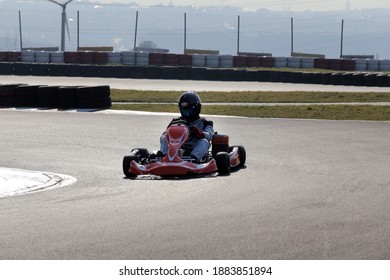 Istanbul, Turkey -August 5 2019 : Driver In Gear, Gloves And Helmet Drives A Racing Car. Go Kart In Action.