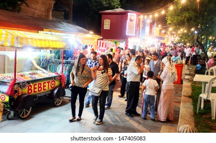 ISTANBUL, TURKEY - AUGUST 8: People Having Fun Before Dinner In Feshane At Ramadan Night On August 8, 2011 In Turkey. Feshane Is An Entertainment Center Of Istanbul In Ramadan.