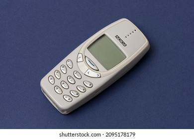 ISTANBUL, TURKEY - DECEMBER 18 2021: Cell phone Nokia 3310 on the blue background.