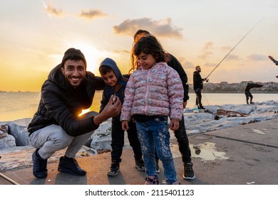 Istanbul Turkey; Family Fishing At Sunset On Samatya Beach. Happy Kids. 15 November 2021 