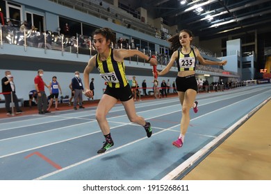ISTANBUL, TURKEY - FEBRUARY 07, 2021: Athletes running 4x400 metres relay during Turkish Indoor Athletics Championships