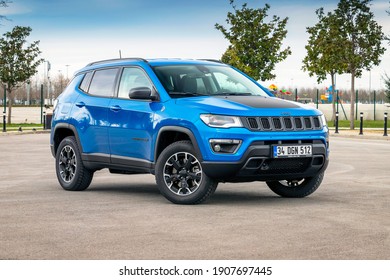 Istanbul, Turkey - February 1 2021 : Jeep Compass is a compact crossover SUV. All wheel drive hybrid car is parked for photoshoot.