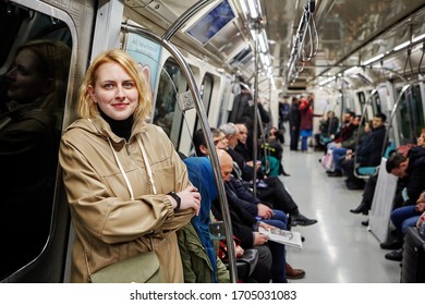 Istanbul, Turkey - February 12, 2020: Young Caucasian Woman In The Passenger Compartment Of A Subway Train Carriage.