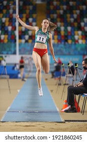 ISTANBUL, TURKEY - FEBRUARY 20, 2021: Undefined athlete long jumping during Balkan Athletics Indoor Championships
