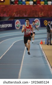 ISTANBUL, TURKEY - FEBRUARY 20, 2021: Undefined athlete running 4x400 metres relay during Balkan Athletics Indoor Championships