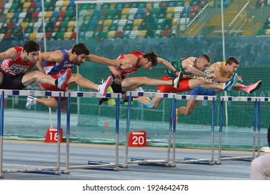 ISTANBUL, TURKEY - FEBRUARY 20, 2021: Athletes Running 60 Metres Hurdles During Balkan Athletics Indoor Championships