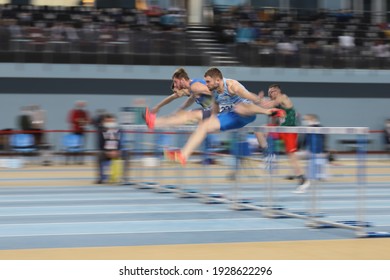 ISTANBUL, TURKEY - FEBRUARY 20, 2021: Athletes Running 60 Metres Hurdles During Balkan Athletics Indoor Championships