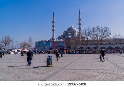 
Istanbul, Turkey - February 23, 2021 - Street Photography Of People On Eminönü Square With Rüstem Pasha Mosque