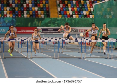 ISTANBUL, TURKEY - JANUARY 30, 2021: Athletes running 60 metres hurdles during Turkish Athletic Federation Olympic Threshold Competitions