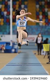 ISTANBUL, TURKEY - JANUARY 30, 2021: Undefined athlete triple jumping during Turkish Athletic Federation Olympic Threshold Competitions