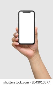 ISTANBUL, TURKEY - JULY 12, 2020: Mockup Of Female Hand Holding  IPhone 11 Pro Gray Smartphone With Blank Screen Isolated On Light Grey Background. High Resolution.