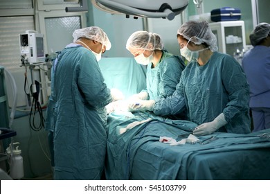 ISTANBUL, TURKEY - JULY 20, 2008: The Doctor And Staff Are Treating With Surgery In Full Operation Room.