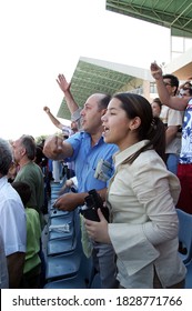 ISTANBUL, TURKEY - JULY 20: Turkish Horse Racing Fans Watching The Horse Race At The Tribune In Veliefendi Hippodrome On July 20, 2005 In Istanbul, Turkey.