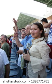 ISTANBUL, TURKEY - JULY 20: Turkish Horse Racing Fans Watching The Horse Race At The Tribune In Veliefendi Hippodrome On July 20, 2005 In Istanbul, Turkey.