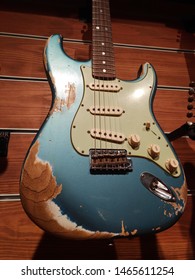 Istanbul, Turkey - July 24, 2019 : A blue and white aged Fender custom shop 1960 stratocaster heavy relic avint model electro guitar on a store.
