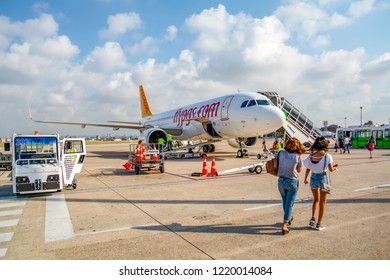 ISTANBUL, TURKEY - JULY 28, 2018:  Airplanes waiting at the airport waiting for their flight. Sabiha Gokcen Airport. Airplanes belonging to Pegasus Airlines. Baggage handling vehicles. Istanbul. Pendi