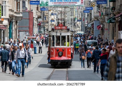 ISTANBUL, TURKEY - JUNE 02, 2014 : The historic Taksim tram runs along Istiklal Caddesi in the Beyoglu district of Istanbul in Turkey.